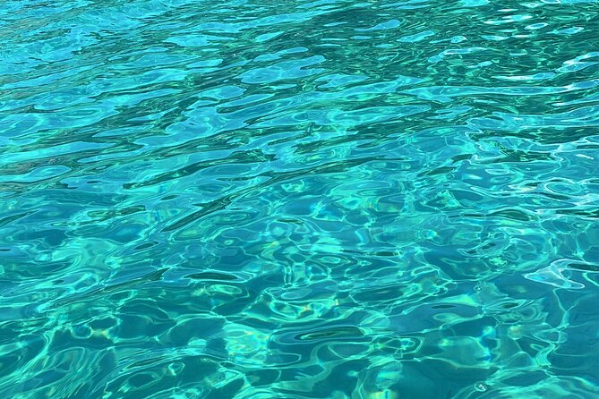 Blue Lagoon cruise: giant slide, music & Paphos hotel transfers - Fontana Amorosa and the Akamas Coast