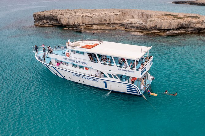 Blue Lagoon trip with slide & music departing from Latchi harbour - Manolis Bay and the fisherman’s cave