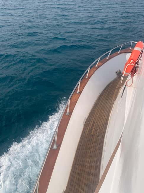Protaras: 80s and 90s Sunset Cruise with Cypriot Dinner & DJ - Green Bay, Turtle Bay, and the swimming stop